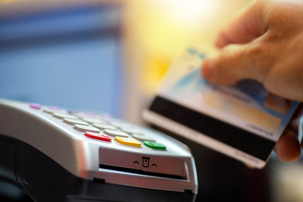Person using credit card machine at a store