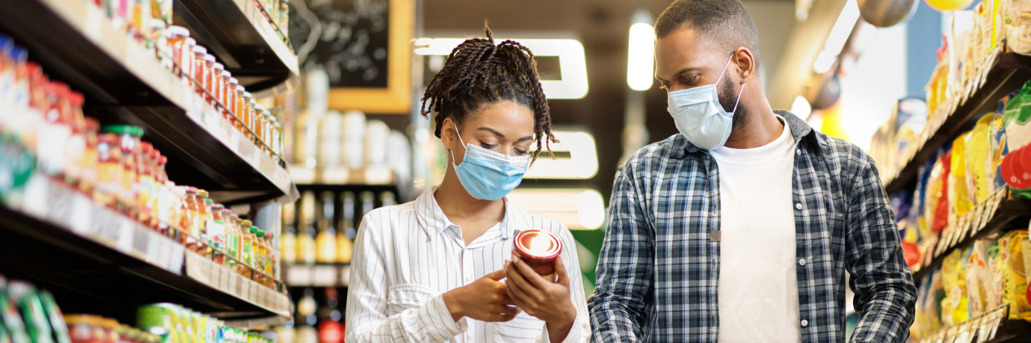 Photo of man and woman shopping at a grocery store