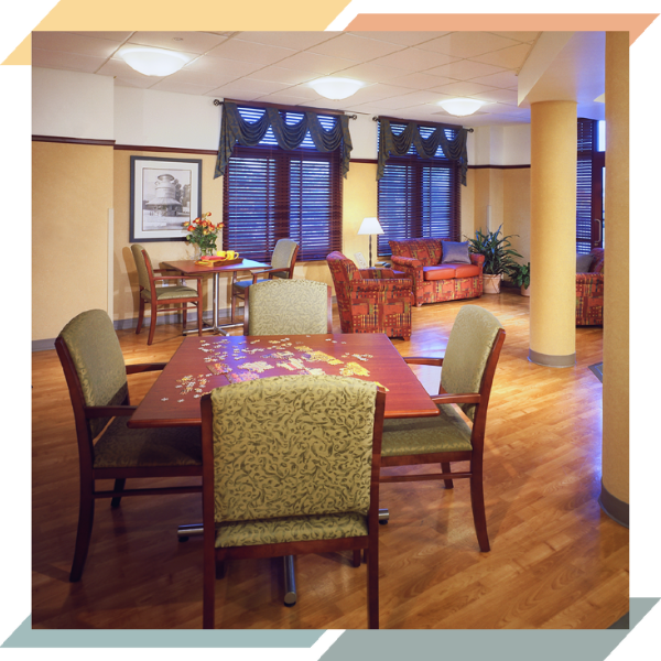 A room with chairs and a table with an unfinished jigsaw puzzle