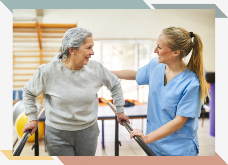 A physical therapist working with an older woman