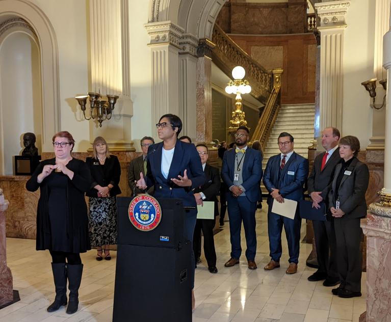 Dr. Morgan Medlock, BHA Comissioner, and partners at the Capitol.